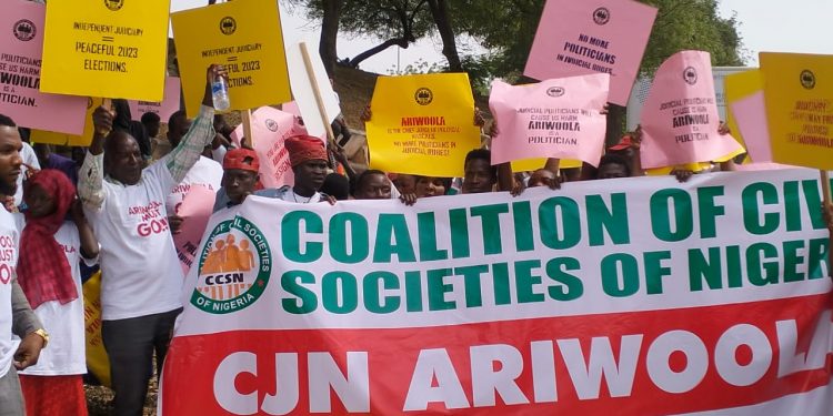 ‘You’re partisan’ — group stages protest, asks CJN to resign over comment on Integrity Group