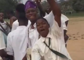 Secondary school student celebrates getting a new car with his mates
